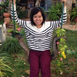 Portrait of smiling young woman in yard