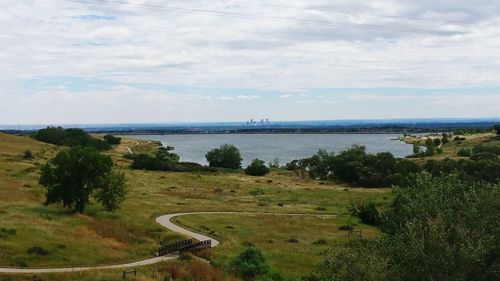 Scenic view of landscape against cloudy sky