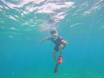 Man swimming in sea