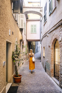 Rear view of woman walking on street