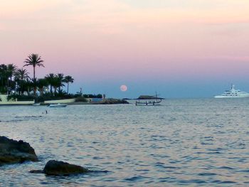 Scenic view of sea against sky at sunset