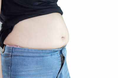 Close-up of woman standing against white background