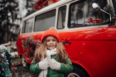 Portrait of smiling young woman in car