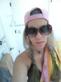 Portrait of young woman wearing sunglasses