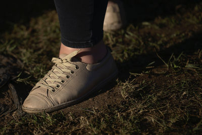 Low section of woman walking on land