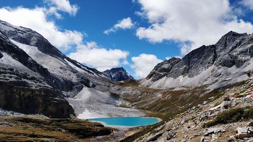 Scenic view of lake and mountains against sky