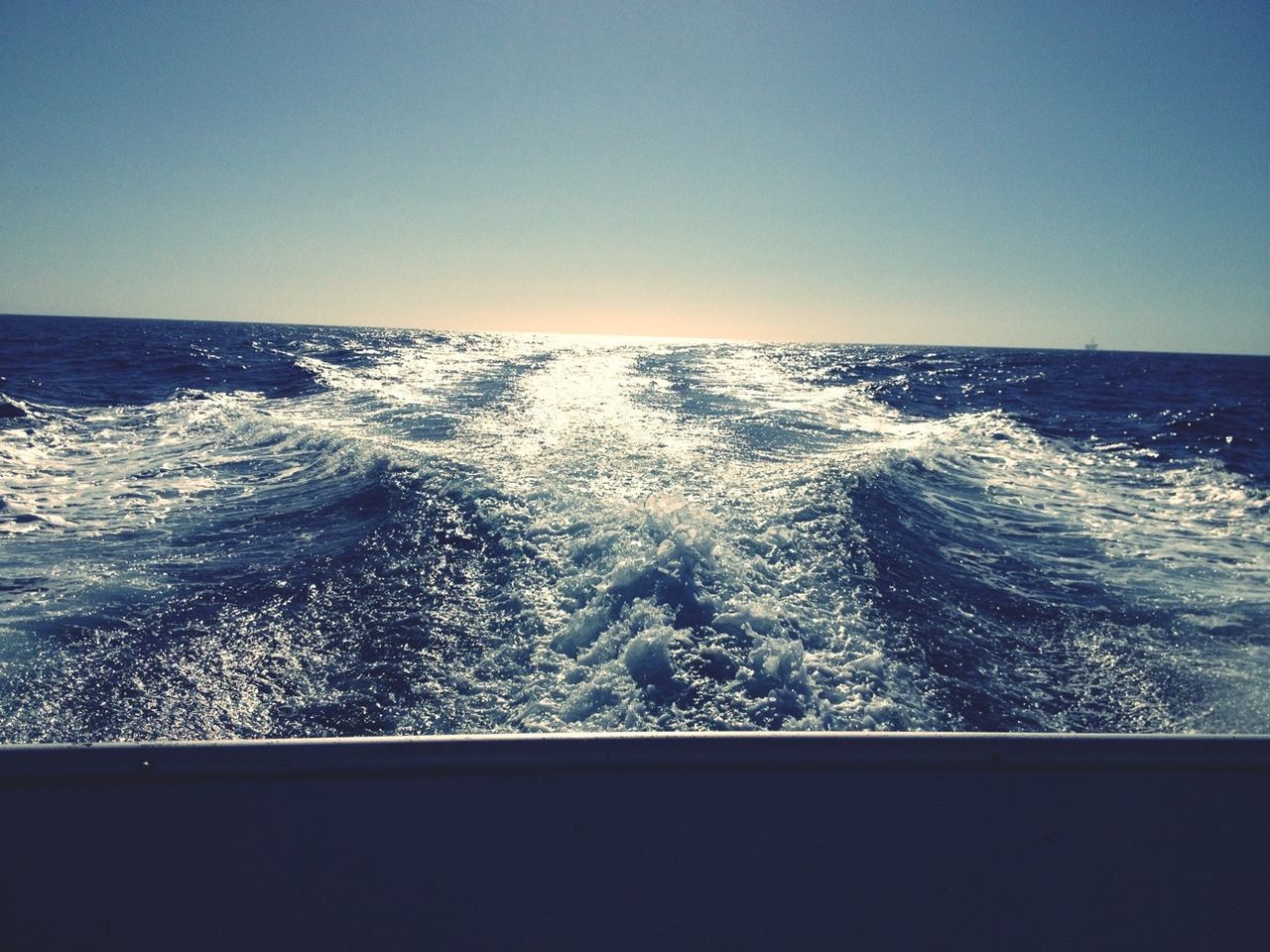 sea, water, horizon over water, clear sky, copy space, scenics, beauty in nature, wave, tranquil scene, blue, nature, seascape, tranquility, idyllic, rippled, surf, motion, waterfront, no people, outdoors