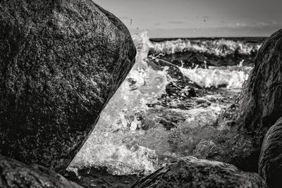 Close-up of wave splashing on rock