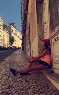 Woman sitting on a street