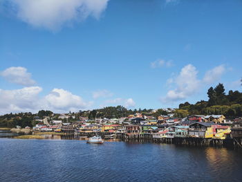 Scenic view of townscape by buildings against sky