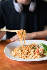 Midsection of woman having food