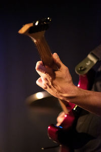 Cropped image of man playing guitar