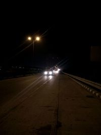 Car on illuminated road at night