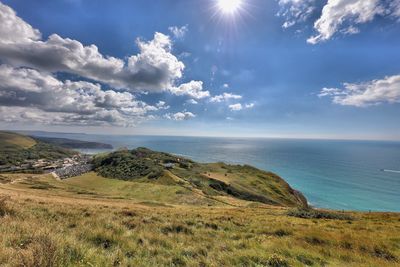 Scenic view of sea against cloudy sky