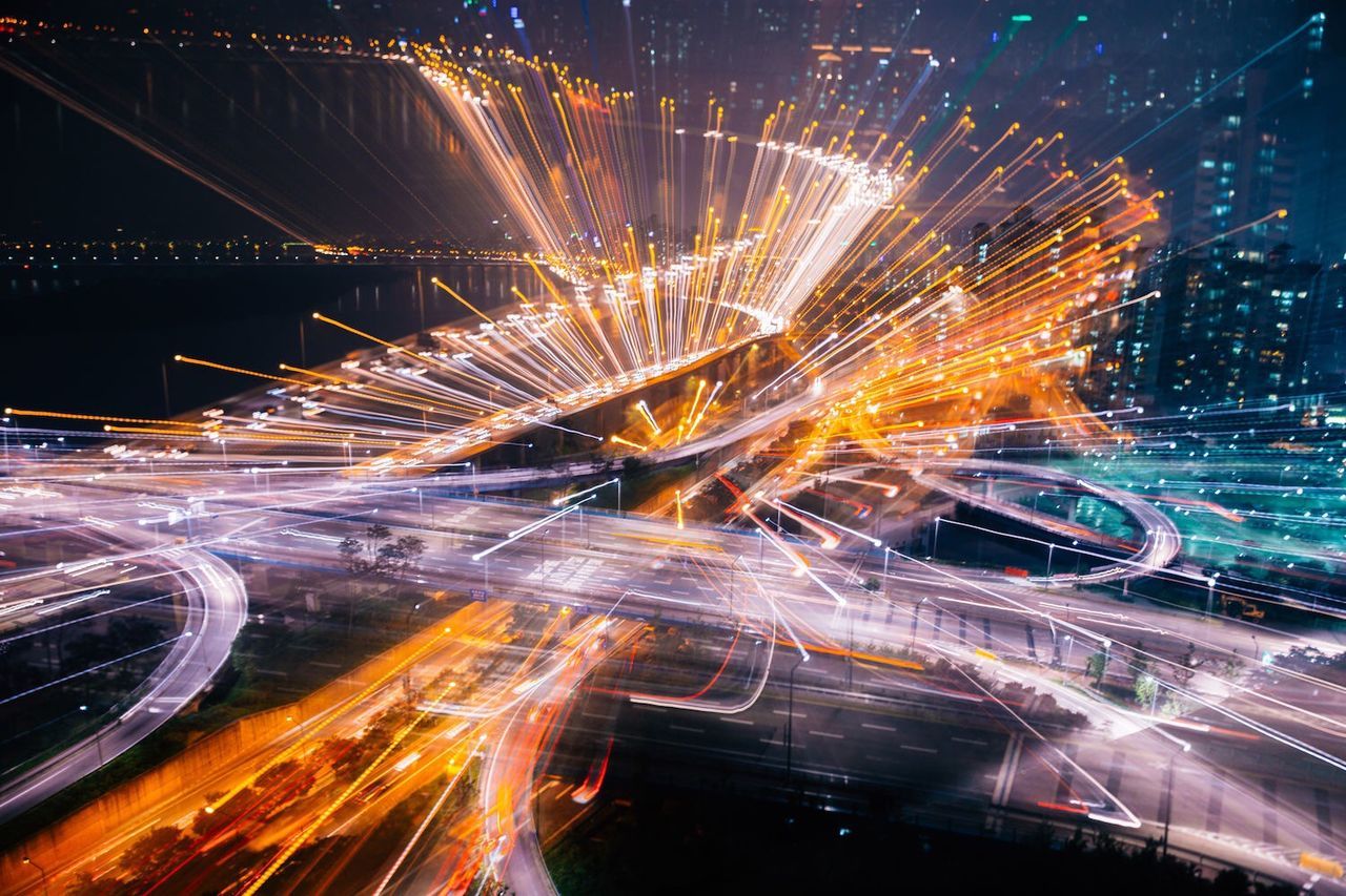 illuminated, night, long exposure, light trail, motion, city, blurred motion, speed, transportation, architecture, building exterior, built structure, traffic, car, city life, street, road, glowing, land vehicle, city street