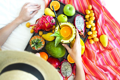 High angle view of woman holding colorful candies