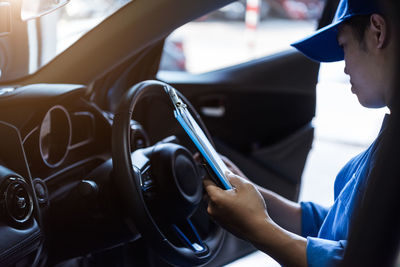 Close-up of man driving car