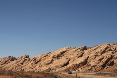 Scenic view of rocky mountains against clear blue sky