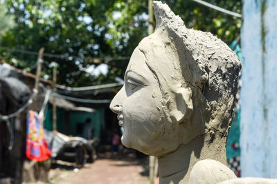 Close up face of goddess durga idol. at a potter's studio in kumartuli in kolkata.