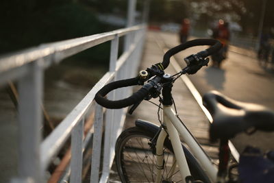 High angle view of bicycle parked by railing