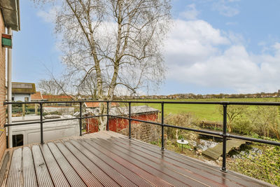 Bridge over field against sky