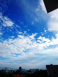 Low angle view of buildings against blue sky