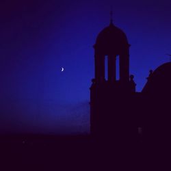 Low angle view of church against blue sky