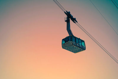 Low angle view of street light against sky during sunset