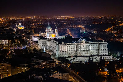 High angle view of illuminated buildings in city at night