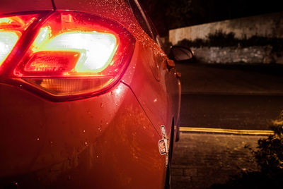 Close-up of illuminated red car