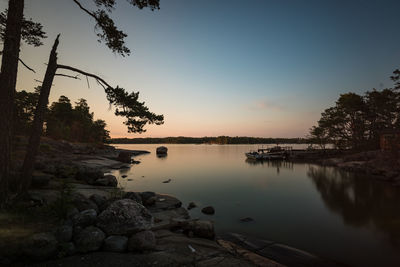 Scenic view of lake against sky during sunset