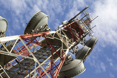 Low angle view of telecommunication tower against sky