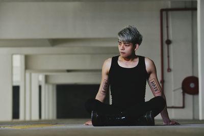 Portrait of man sitting at home