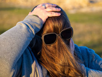 Close-up portrait of woman wearing sunglasses