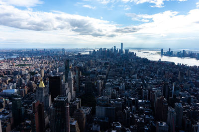 High angle view of modern buildings in city against sky