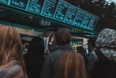 Rear view of people at railroad station platform
