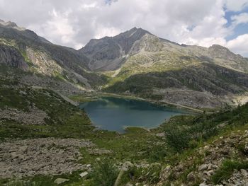 Scenic view of lake and mountains against sky