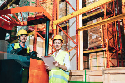 Portrait of people working at construction site