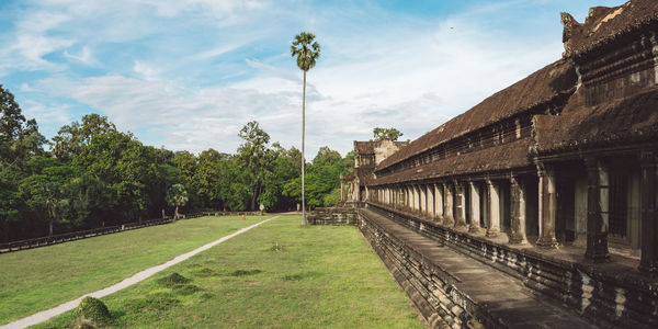 Panoramic shot of temples amidst trees against sky