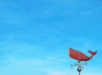 Low angle view of basketball hoop against blue sky