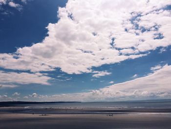 Scenic view of sea against cloudy sky