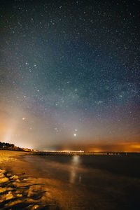 Scenic view of sea against sky at night