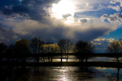 Scenic view of lake against sky during winter