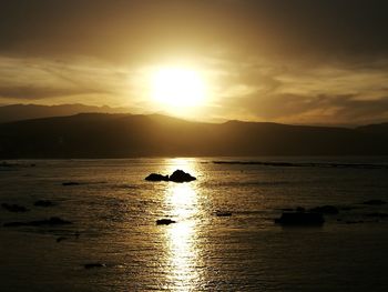 Scenic view of sea against sky during sunset