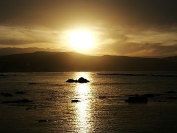 Scenic view of sea against sky during sunset