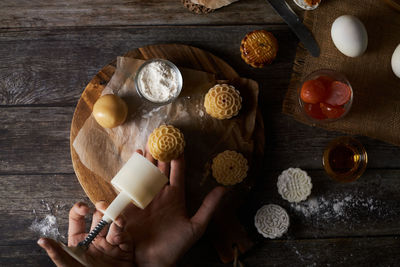 High angle view of person preparing food on table