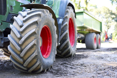 Close-up of tractor on dirt road