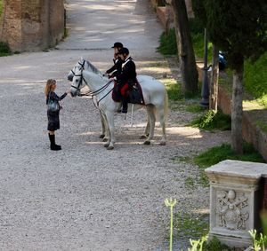 Men riding horse