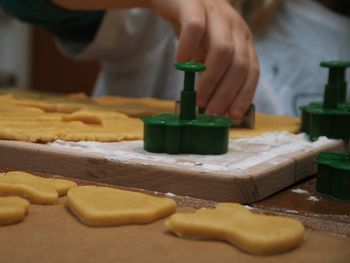 Close-up of person preparing food on table