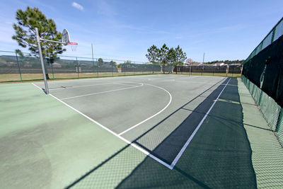 An empty full size basketball court in florida